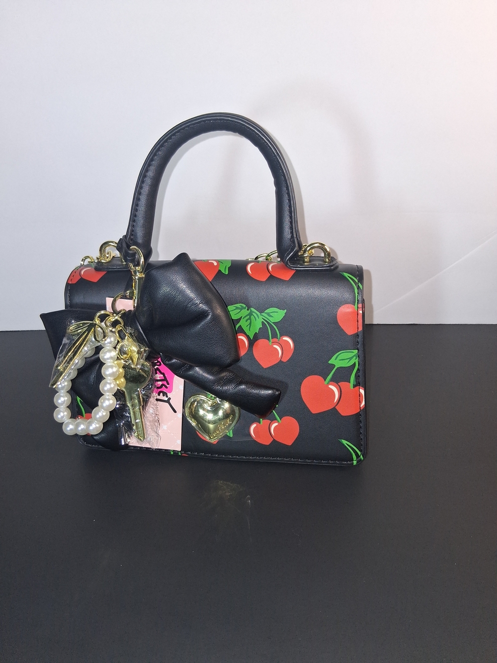 Betsey Johnson Black Cherry Print Crossbody Bag with Bow Charm